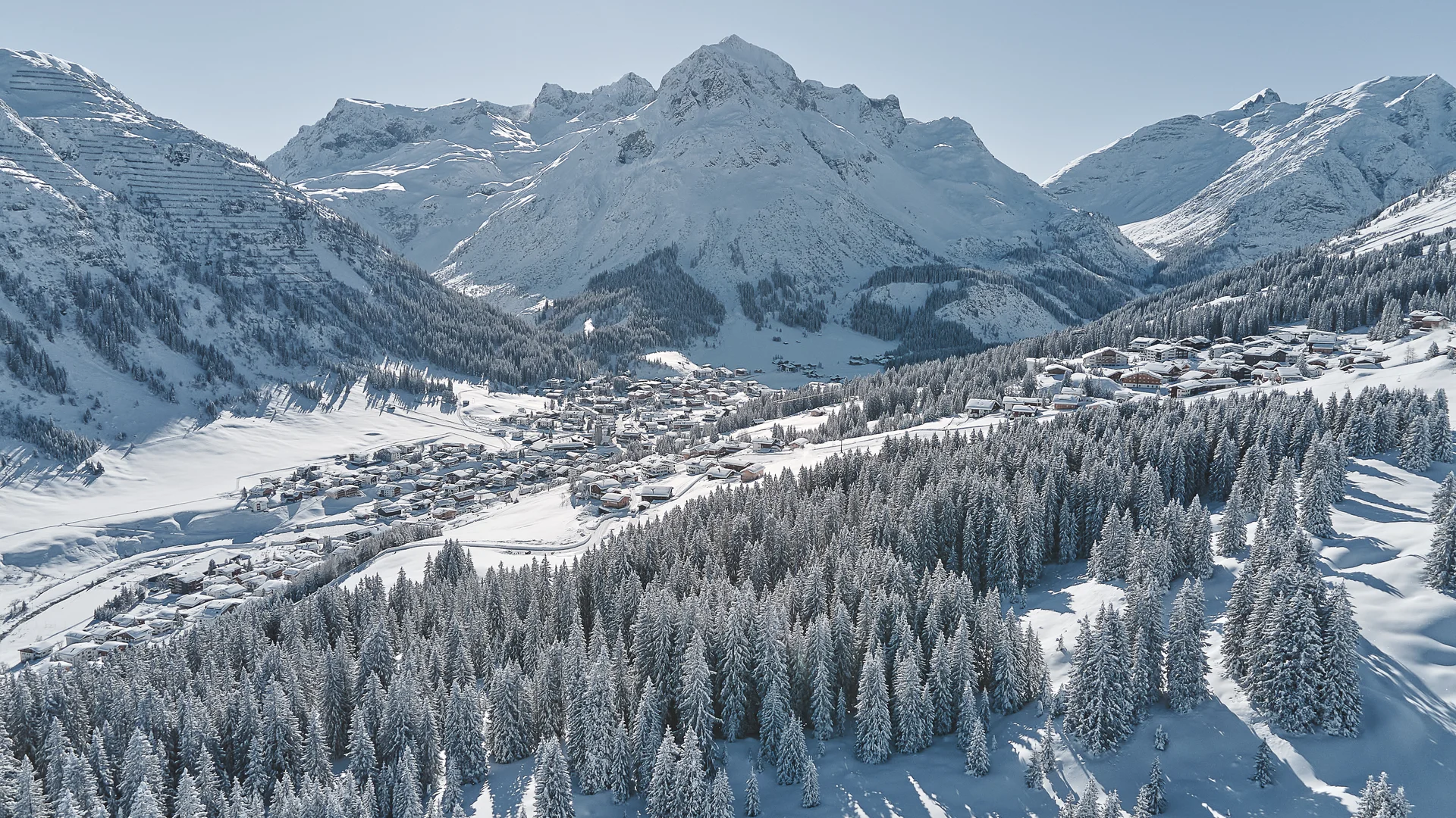 Picture gallery | Hotel Panorama in Lech am Arlberg Snow-covered alpine village among frosted fir trees and towering mountains