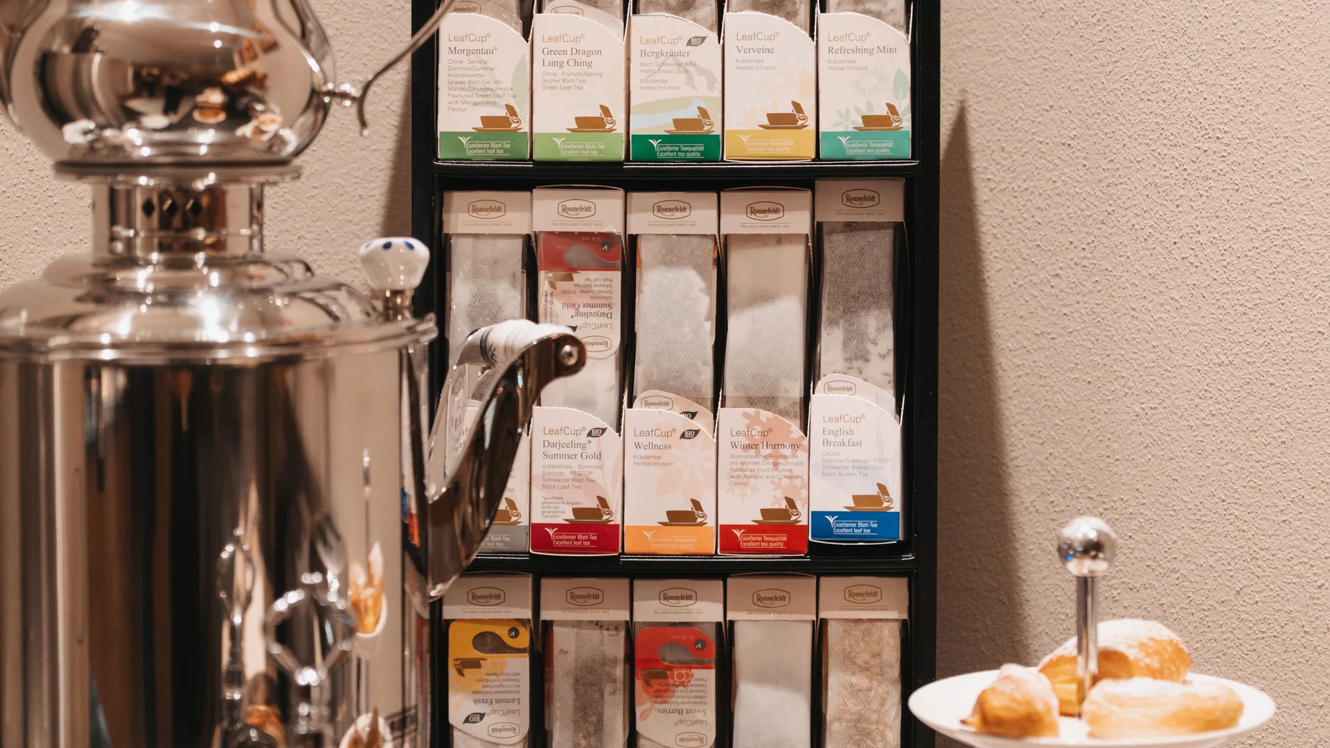 Picture gallery | Hotel Panorama in Lech am Arlberg Tea station with a polished samovar, assorted teas and a tiered stand of pastries