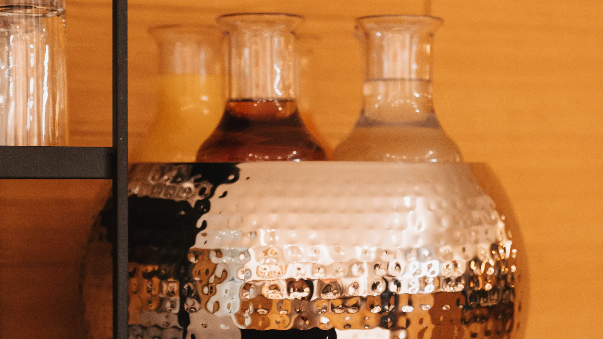 Picture gallery | Hotel Panorama in Lech am Arlberg Glass carafes with drinks and a sign listing orange, apple, multivitamin, water and grapefruit
