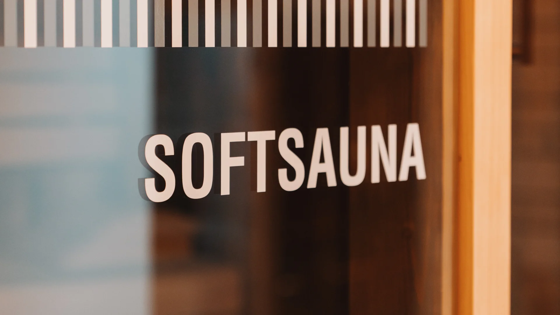 Picture gallery | Hotel Panorama in Lech am Arlberg Glass door to a soft sauna with a wooden frame and Softsauna lettering