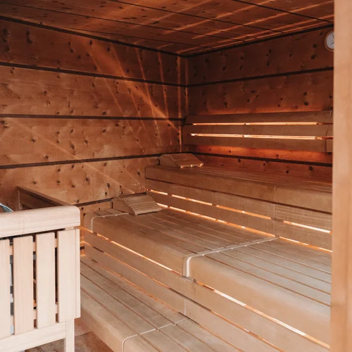 Inclusive services | Hotel Panorama in Lech am Arlberg Wooden sauna interior with tiered benches