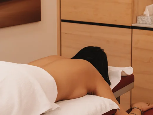 Service at Hotel Panorama in Lech am Arlberg Person lies face down on a massage table with their back exposed