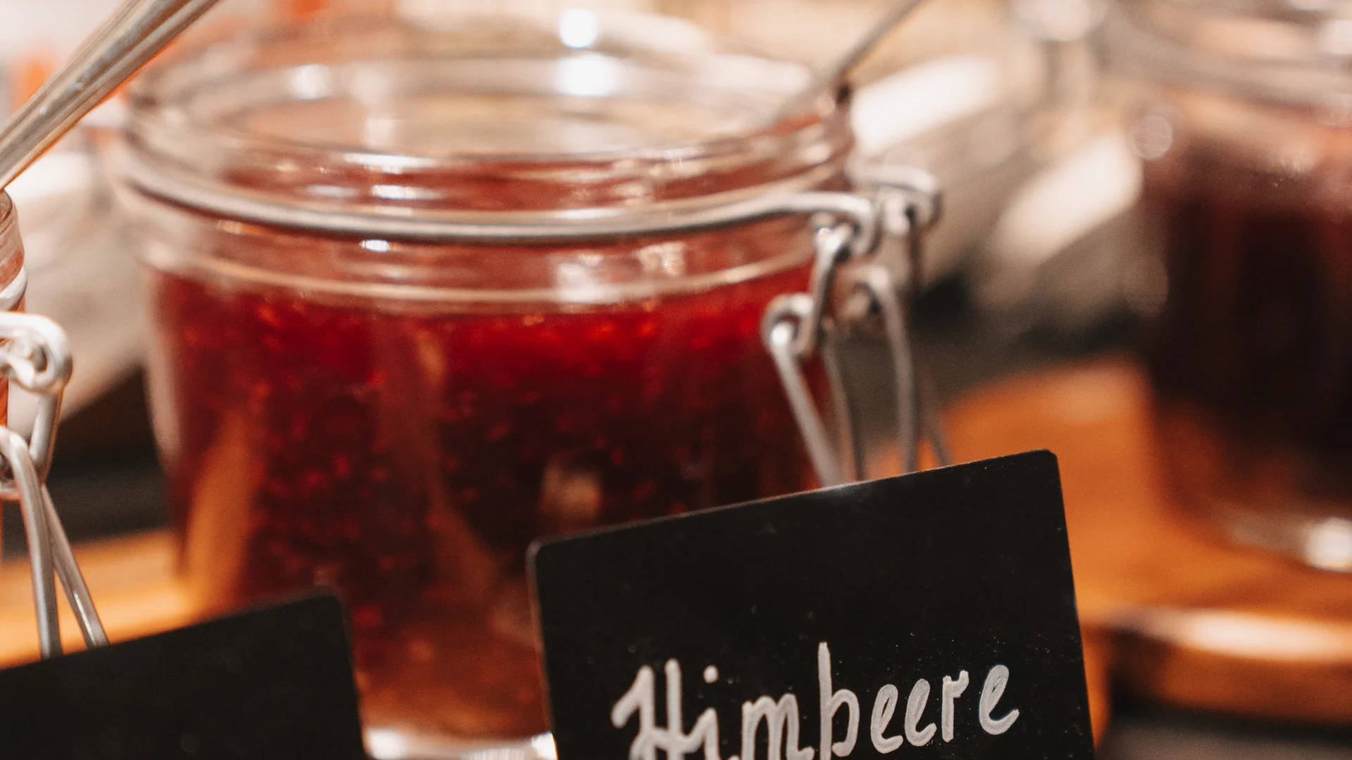 Picture gallery | Hotel Panorama in Lech am Arlberg Jar of raspberry jam beside a sign labeled raspberry