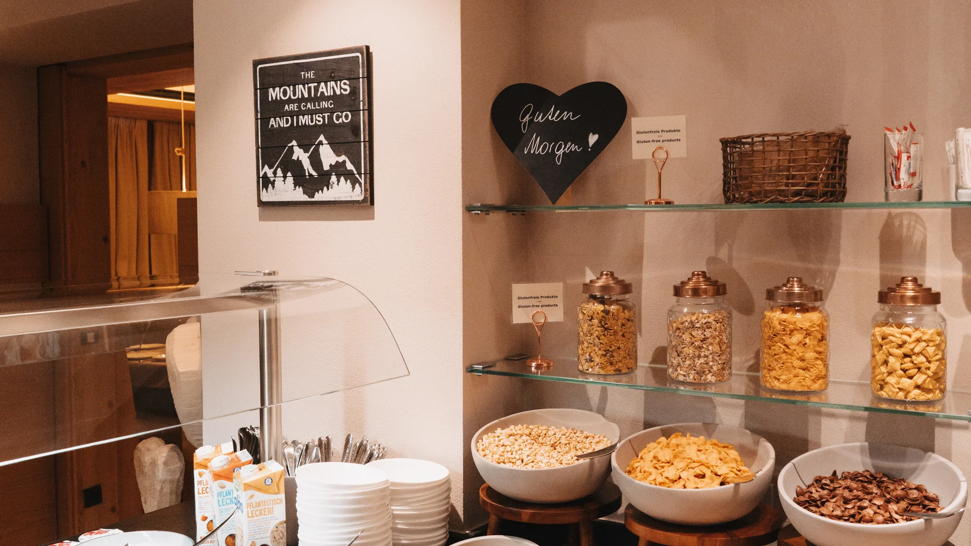 Picture gallery | Hotel Panorama in Lech am Arlberg Breakfast buffet with muesli, cereal, nuts and dried fruit in bowls